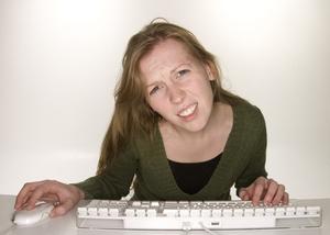 confused woman looking at the editorial calendar for her business blog